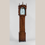 Fig. 8: Tall Clock with case attributed to John Brown (1761–1835) and movement attributed to clockmaker Hugh Andrews (1761–1821), 1800–1805, Wellsburg, WV. Finials and fluted plinths replaced; shaped skirt restored. Cherry and cherry veneer with light and dark wood inlays and tulip poplar; HOA: 96”, WOA: 20-5/8", DOA: 10-1/2". MESDA Collection, Acc. 4357; available online: https://mesda.org/item/collections/tall-case-clock/2566/ (accessed 28 August 2019); Photograph by Wes Stewart.